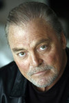 Narrator - Stacy Keach